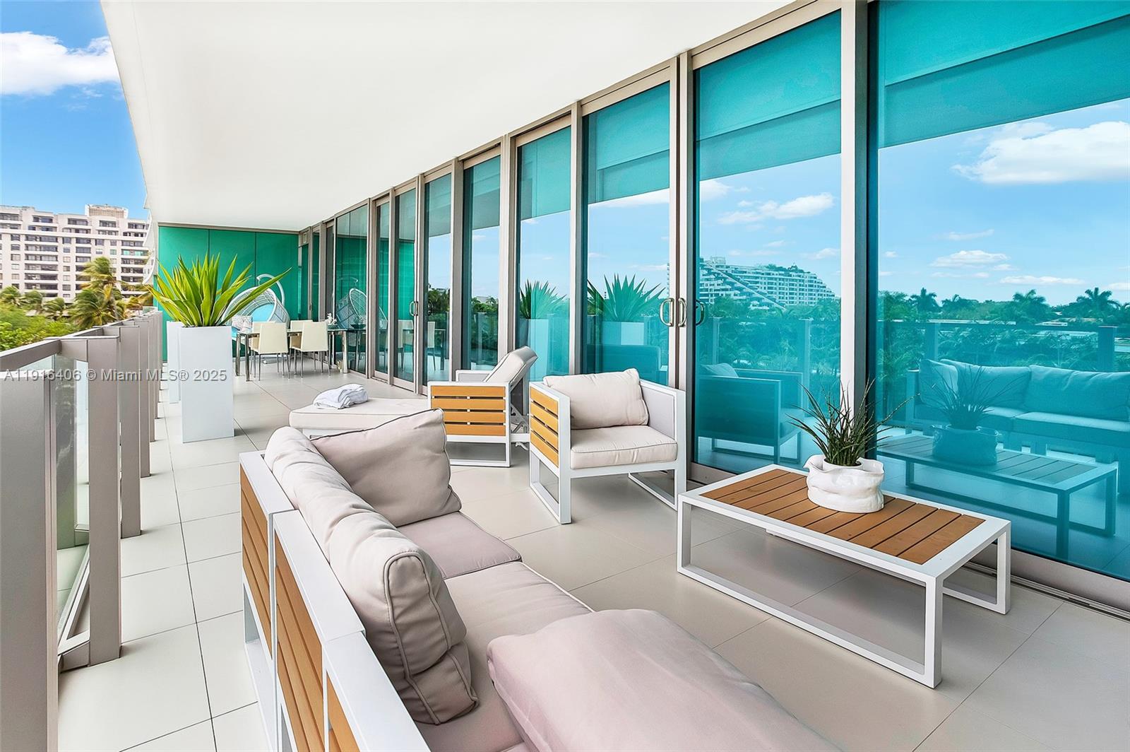 350 Ocean Drive, Unit 405N Key Biscayne, FL 33149 - Photo 17 of 34 a outdoor living space with furniture and garden view