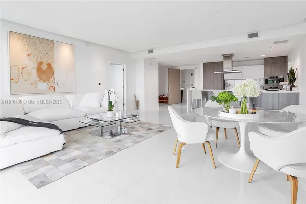 a living room with furniture and white walls