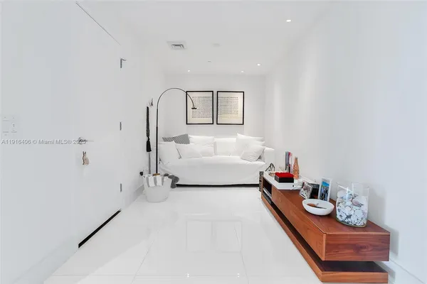 a bedroom with bed and window