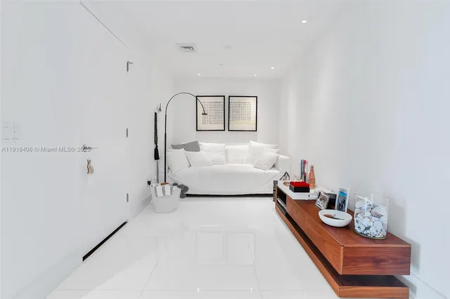 a bedroom with bed and window