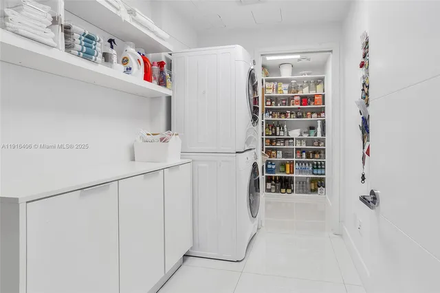 a view of storage and utility room with washer and dryer