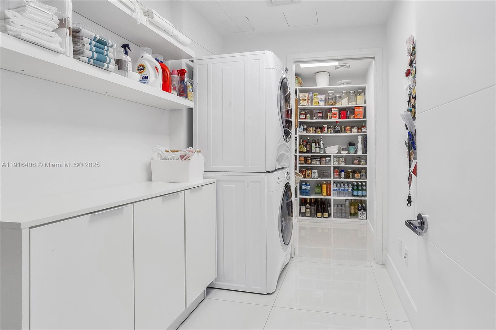 350 Ocean Drive, Unit 405N Key Biscayne, FL 33149 - Photo 10 of 34 a view of storage and utility room with washer and dryer