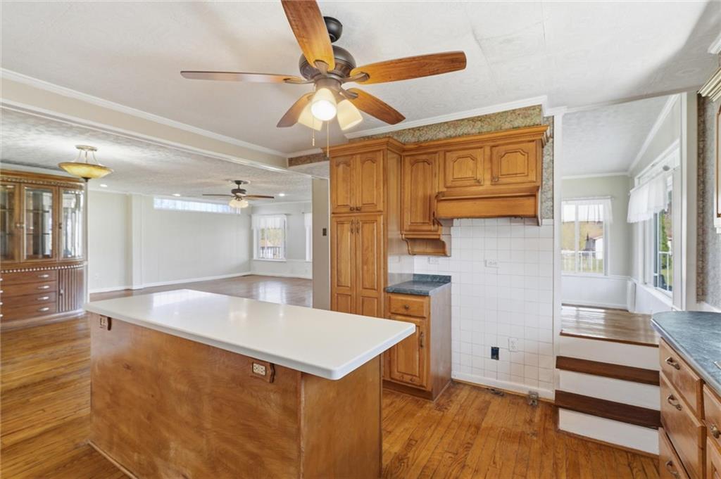 54 Terrace Road Millsboro, PA 15348 - Photo 11 of 49 a kitchen with a refrigerator a sink and cabinets