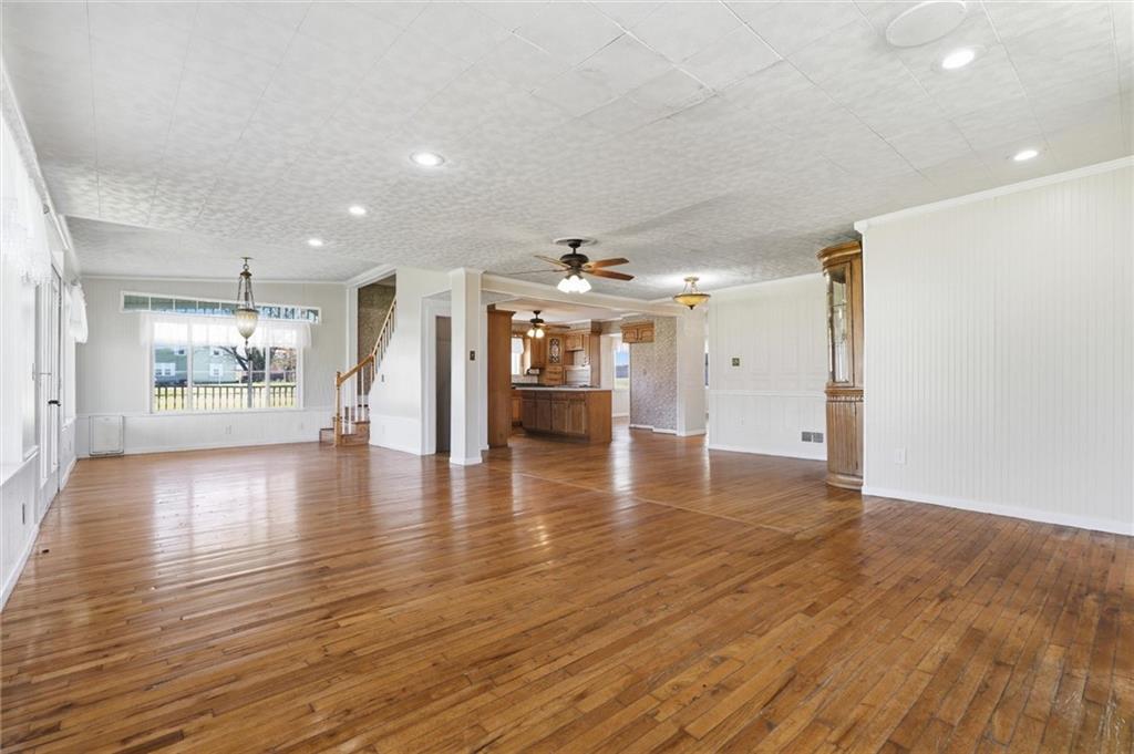 54 Terrace Road Millsboro, PA 15348 - Photo 13 of 49 a view of a livingroom with a furniture wooden floor and kitchen