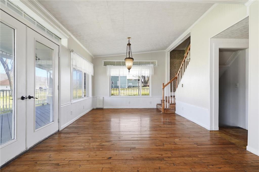 54 Terrace Road Millsboro, PA 15348 - Photo 15 of 49 a view of an empty room with wooden floor and a window