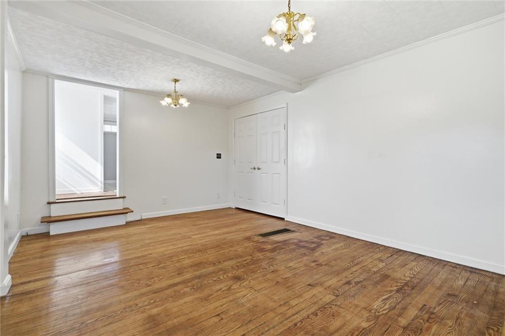 54 Terrace Road Millsboro, PA 15348 - Photo 17 of 49 wooden floor in an empty room with a window