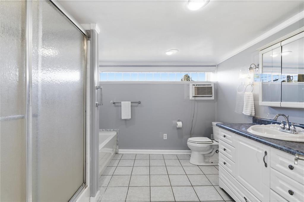 54 Terrace Road Millsboro, PA 15348 - Photo 19 of 49 a bathroom with a sink a toilet and shower
