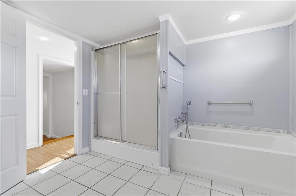 54 Terrace Road Millsboro, PA 15348 - Photo 20 of 49 a spacious bathroom with a bathtub and a shower