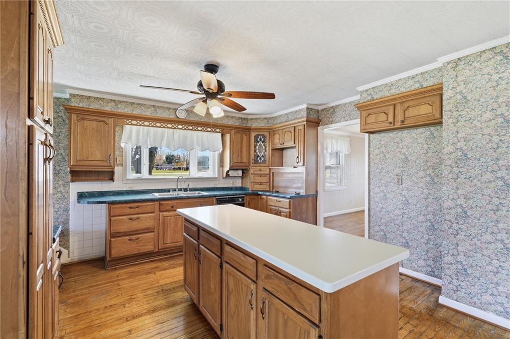 54 Terrace Road Millsboro, PA 15348 - Photo 8 of 49 a kitchen with stainless steel appliances granite countertop a sink a stove and a refrigerator