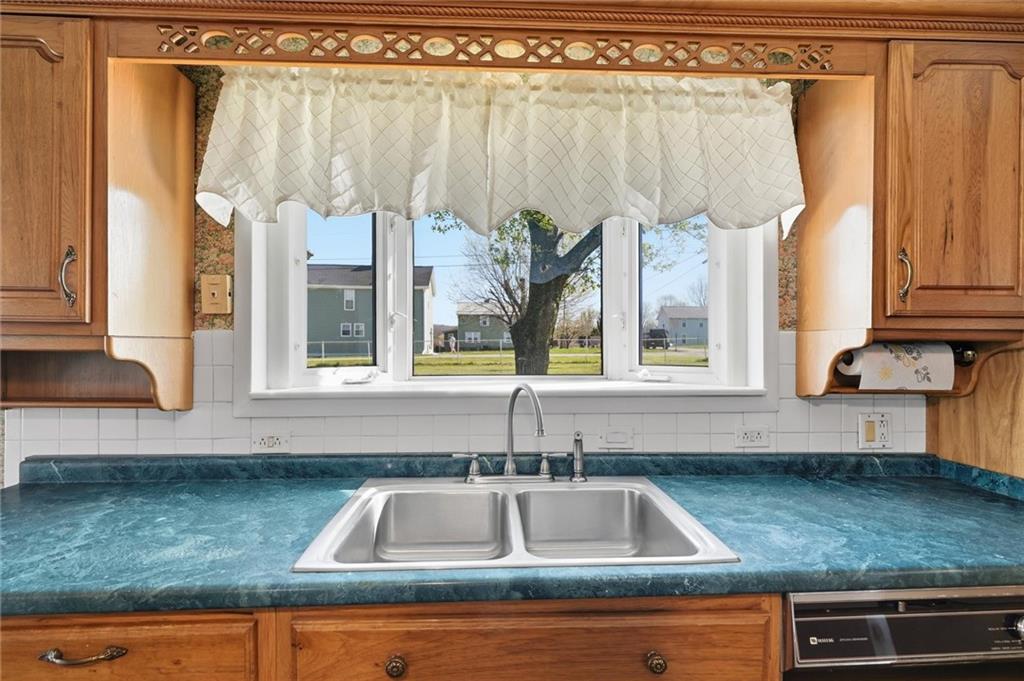 54 Terrace Road Millsboro, PA 15348 - Photo 10 of 49 a kitchen with a sink window and cabinets
