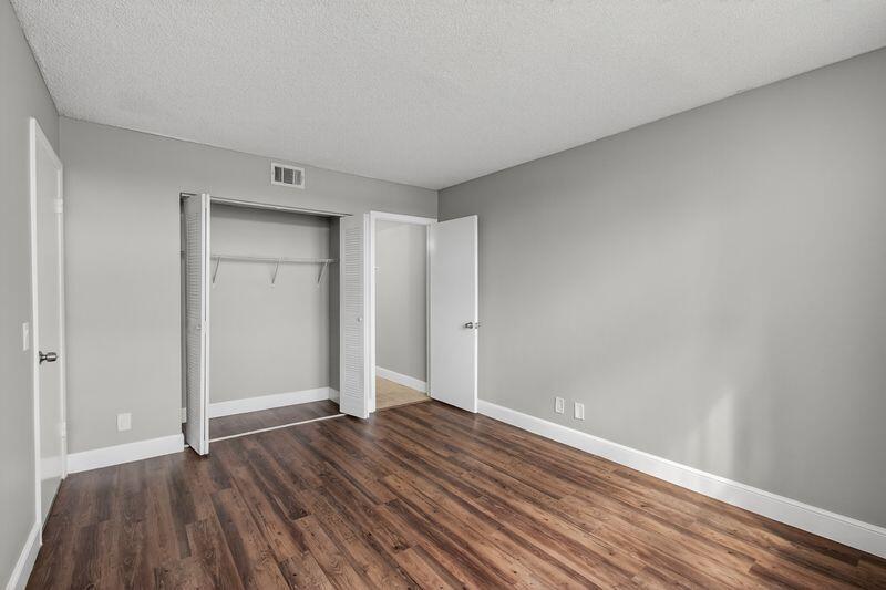 744 Executive Center Drive, Unit 11 West Palm Beach, FL 33401 - Photo 11 of 29 a view of room with wooden floor