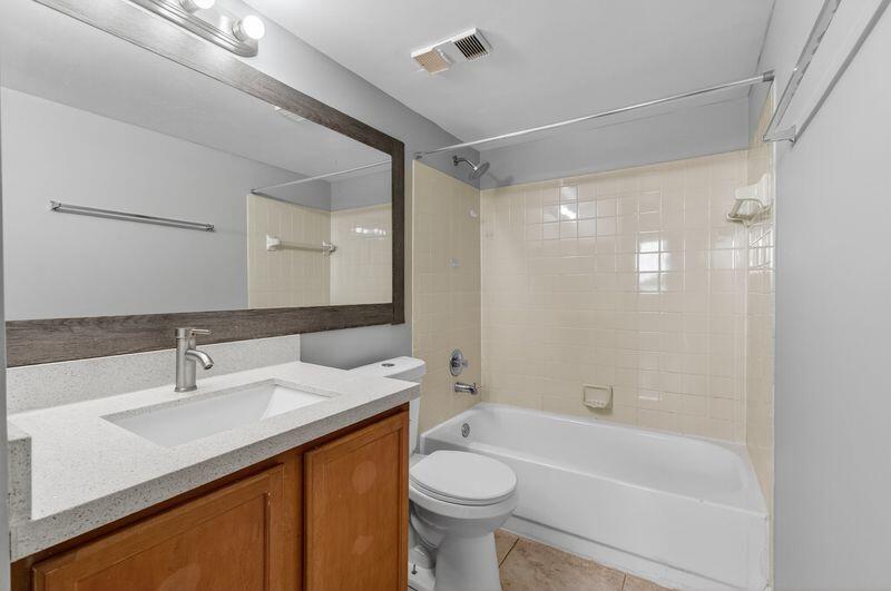 744 Executive Center Drive, Unit 11 West Palm Beach, FL 33401 - Photo 12 of 29 a bathroom with a sink a toilet and shower
