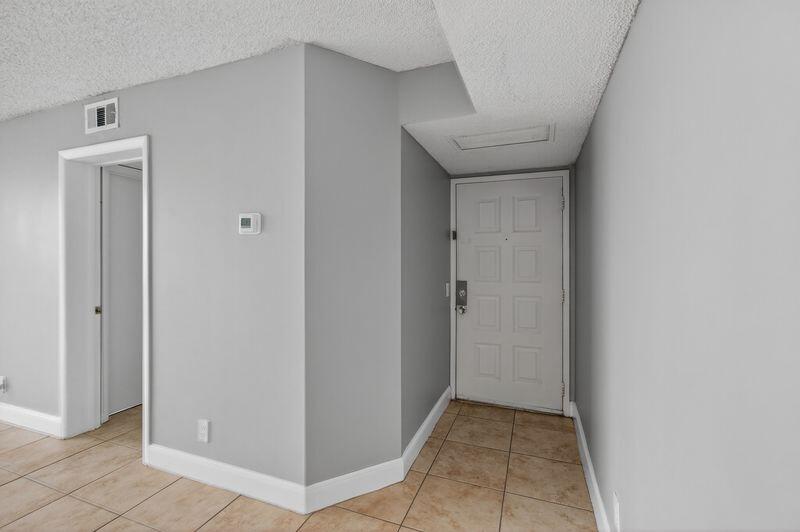 744 Executive Center Drive, Unit 11 West Palm Beach, FL 33401 - Photo 5 of 29 a view of a hallway