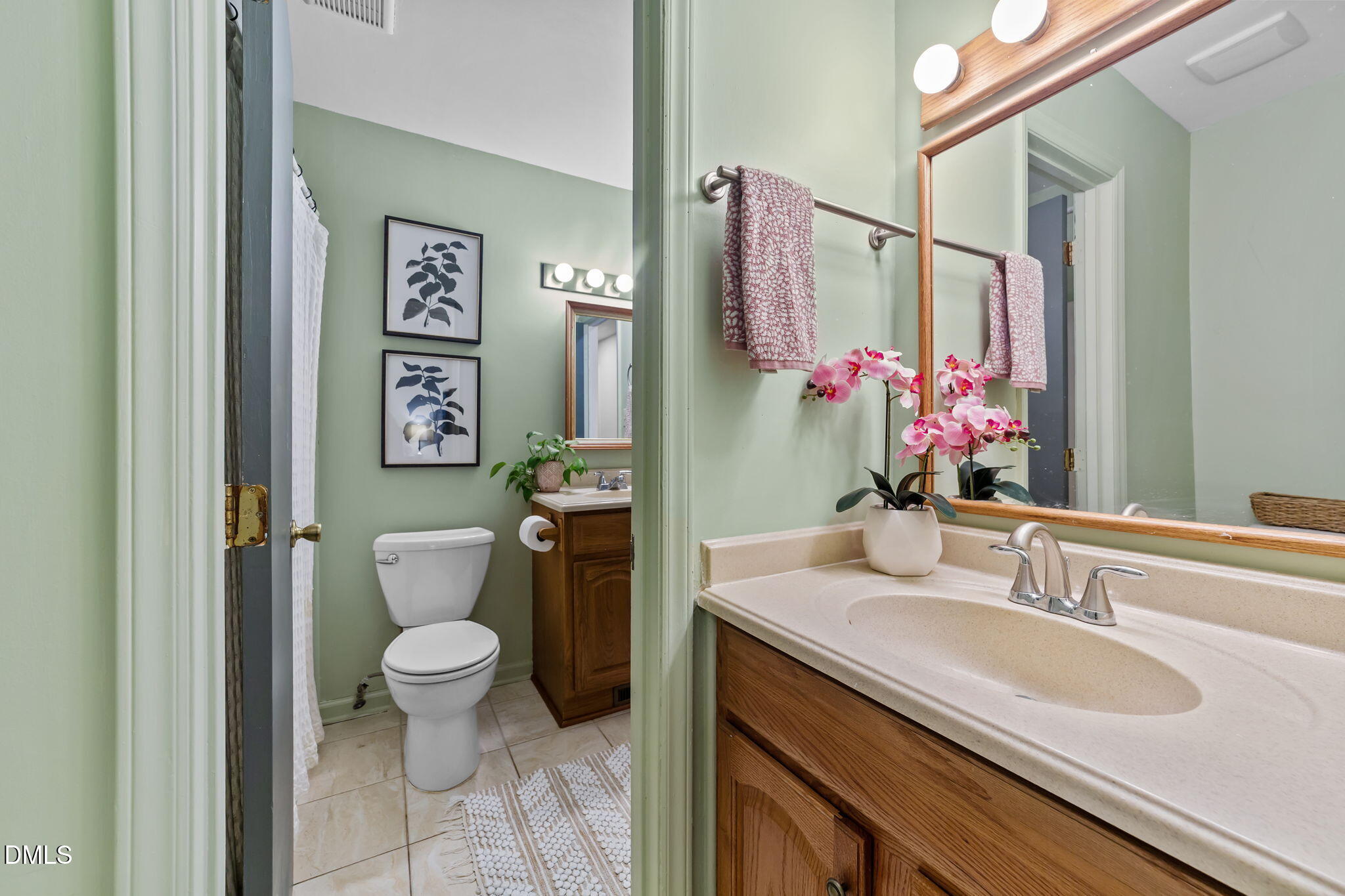 105 Barcliff Terrace Cary, NC 27518 - Photo 22 of 47 a bathroom with a granite countertop sink toilet and a mirror