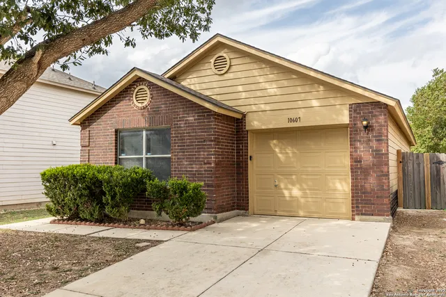 a view of brick house with large windows
