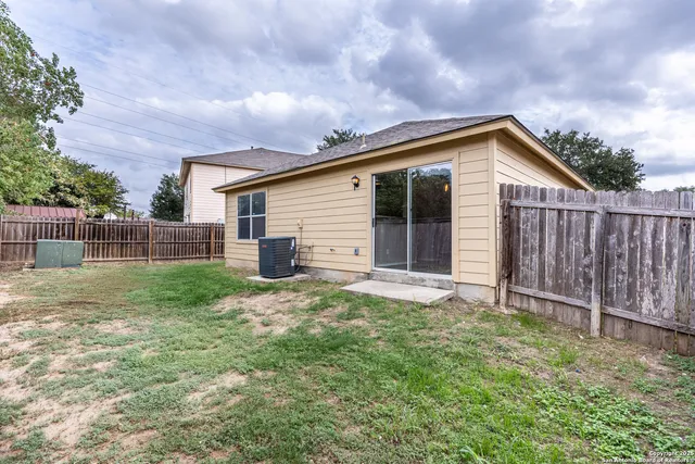 a view of a backyard of the house