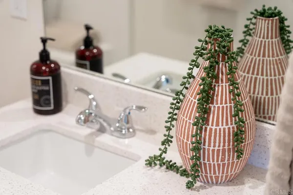 a bathroom with a bathtub and a sink