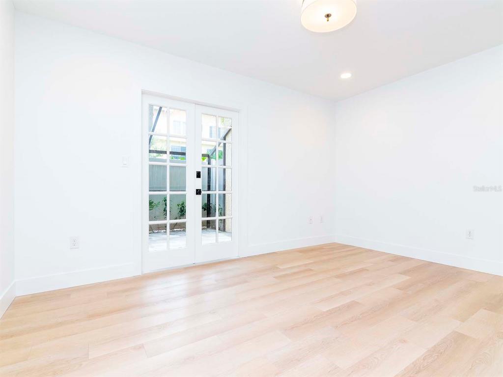 107 South Obrien Street, Unit 118 Tampa, FL 33609 - Photo 14 of 30 a view of empty room with wooden floor