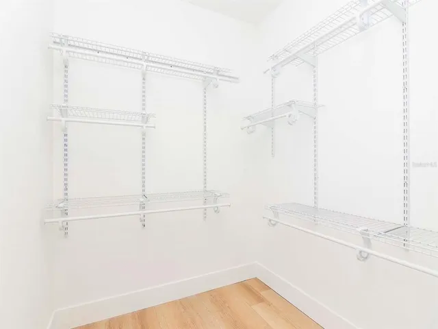 a bathroom with a shower and a sink