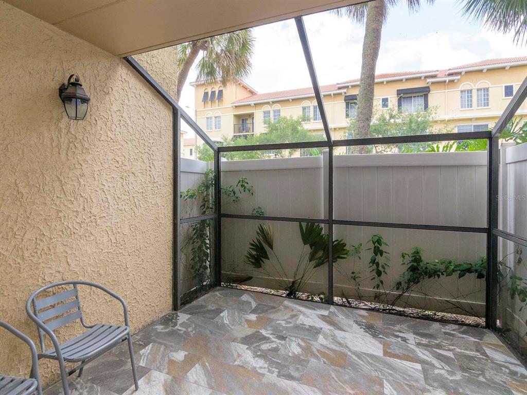 107 South Obrien Street, Unit 118 Tampa, FL 33609 - Photo 26 of 30 a view of a porch with a floor to ceiling windows
