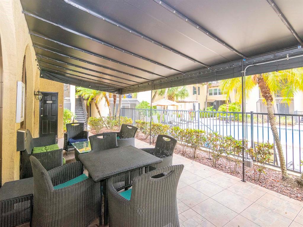 107 South Obrien Street, Unit 118 Tampa, FL 33609 - Photo 30 of 30 a view of a dining room with furniture window and outside view