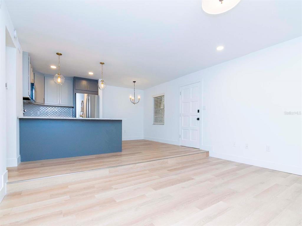 107 South Obrien Street, Unit 118 Tampa, FL 33609 - Photo 3 of 30 a view of kitchen and empty room