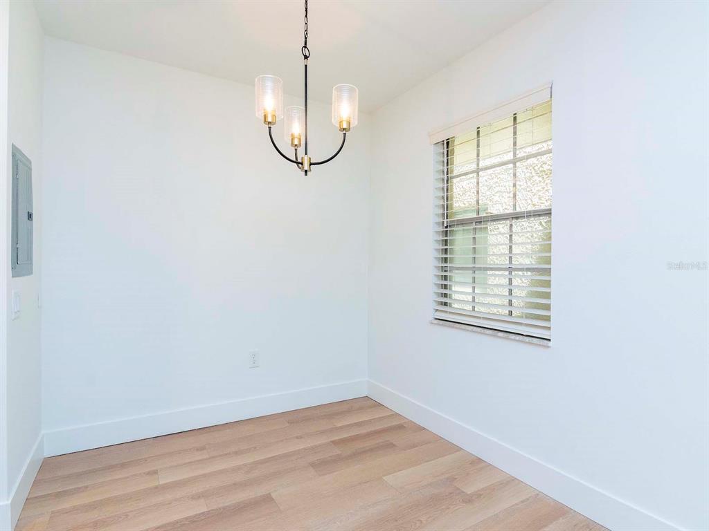 107 South Obrien Street, Unit 118 Tampa, FL 33609 - Photo 8 of 30 an empty room with a empty space and a window