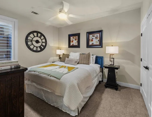 a bedroom with bed and a lamp