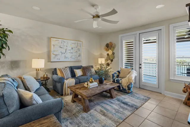a living room with furniture a table and a window