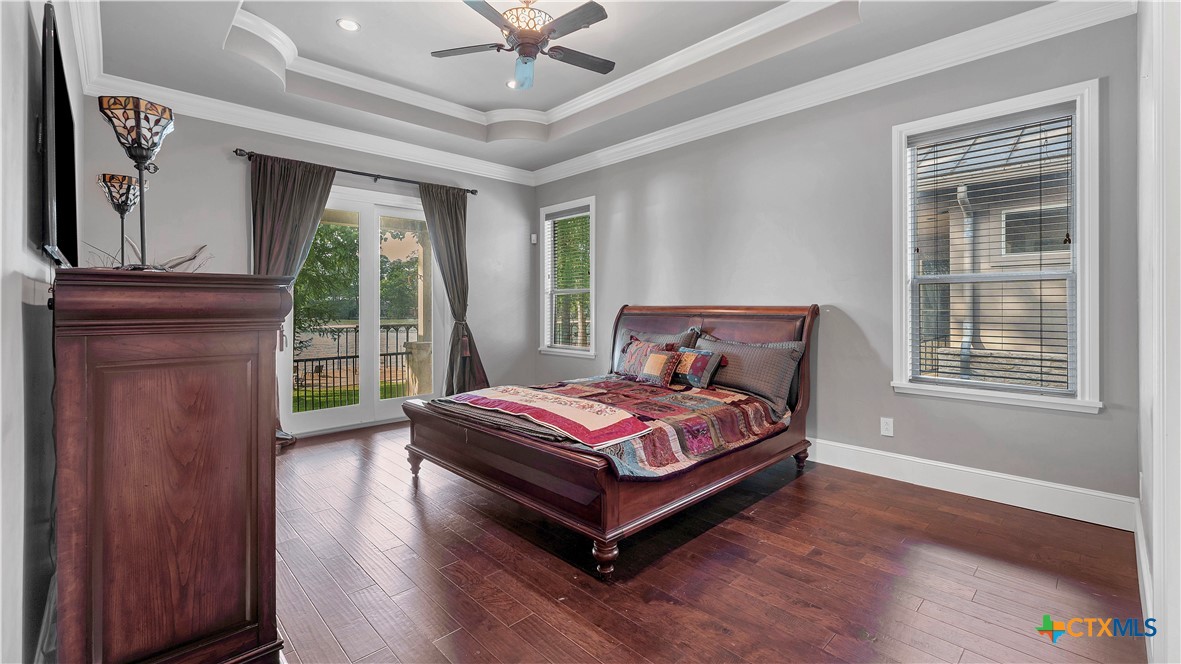 368 Rancho Road New Braunfels, TX 78130 - Photo 15 of 47 a bedroom with a bed and wooden floor