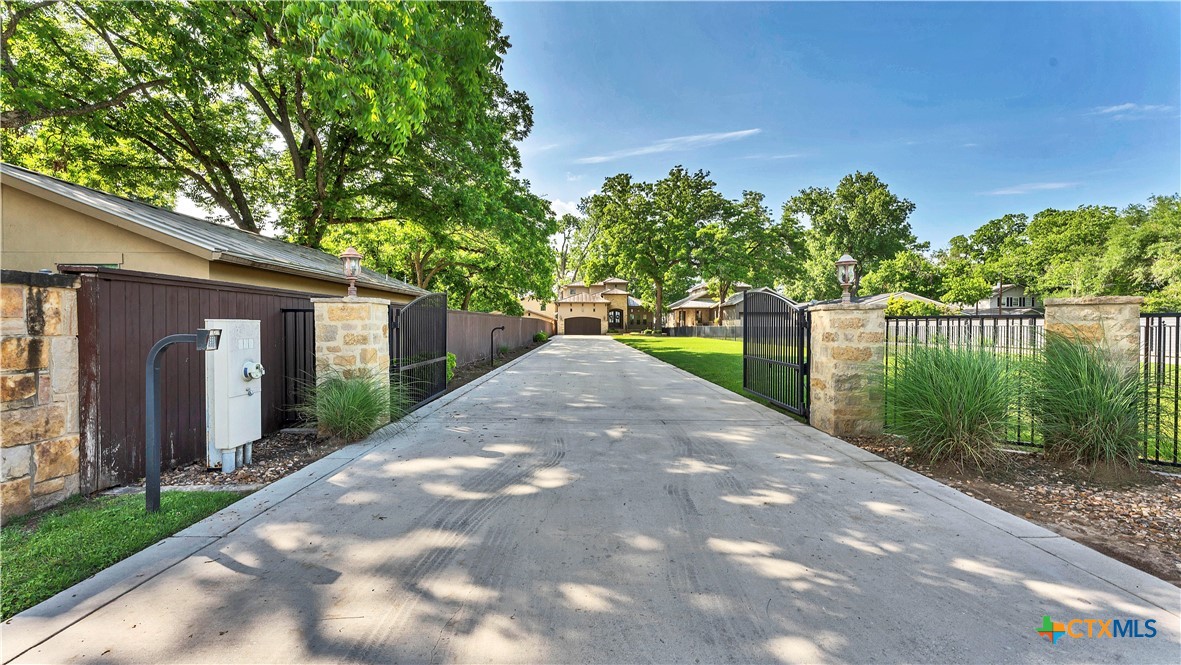 368 Rancho Road New Braunfels, TX 78130 - Photo 2 of 47 a view of a house with a yard