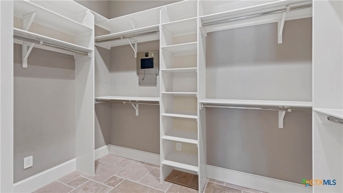 368 Rancho Road New Braunfels, TX 78130 - Photo 21 of 47 a view of walk in closet with empty racks