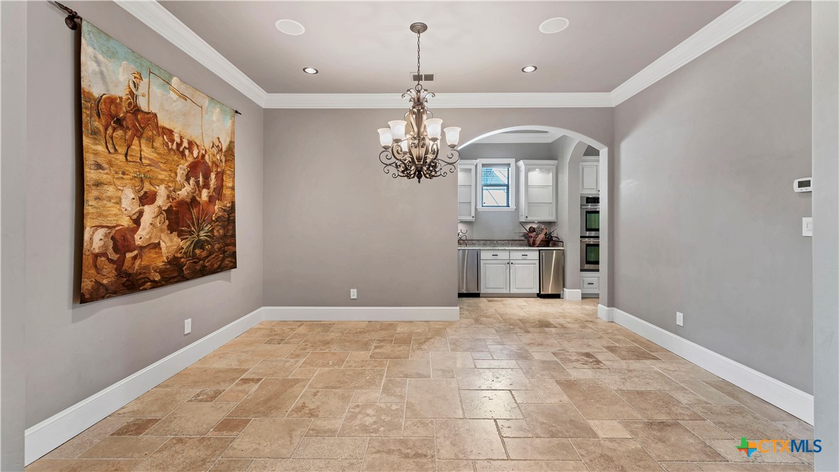 368 Rancho Road New Braunfels, TX 78130 - Photo 23 of 47 a view of a hallway with a chandelier and livingroom view