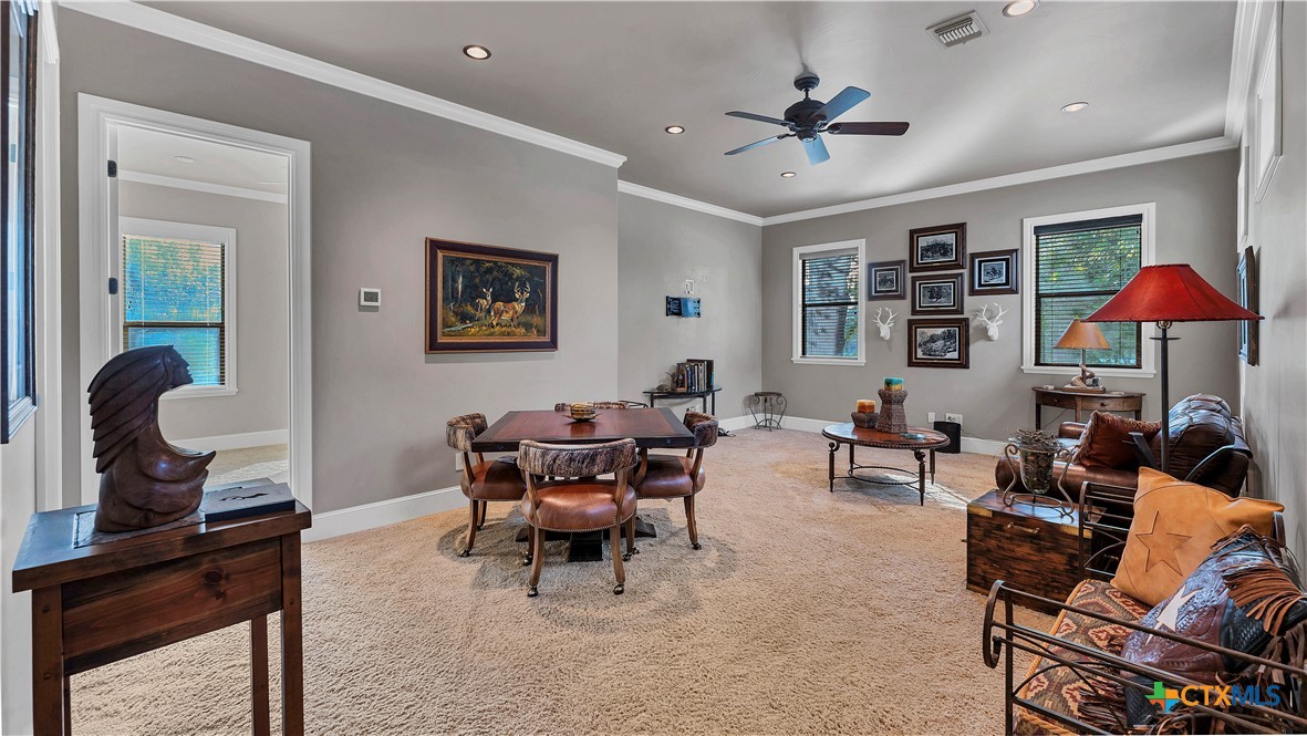 368 Rancho Road New Braunfels, TX 78130 - Photo 26 of 47 a living room with furniture a desk and a piano