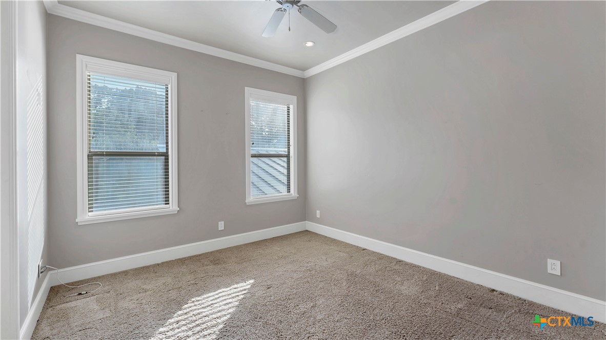 368 Rancho Road New Braunfels, TX 78130 - Photo 28 of 47 an empty room with windows and fan