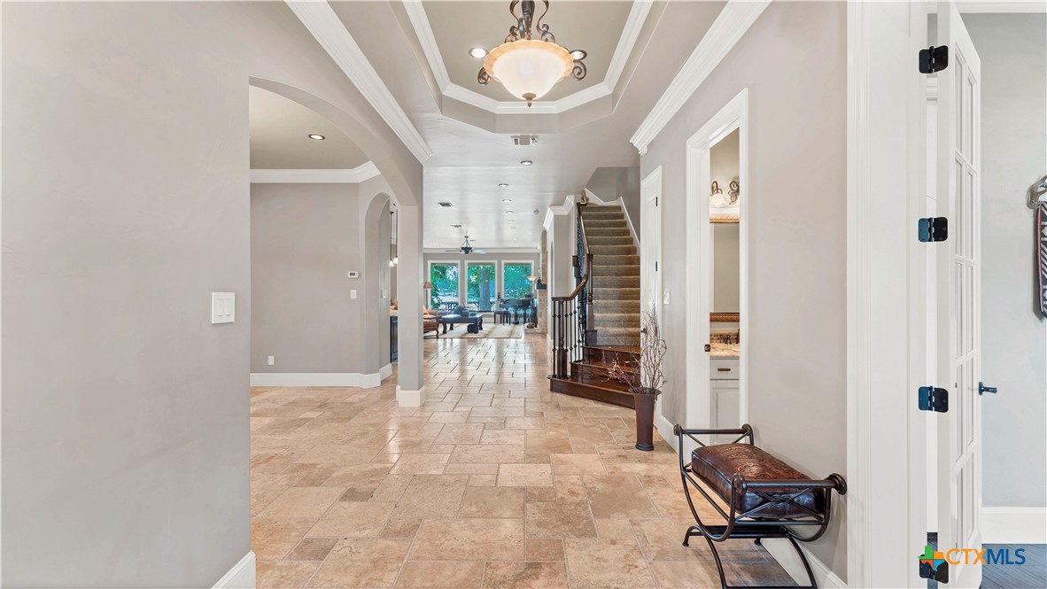 368 Rancho Road New Braunfels, TX 78130 - Photo 3 of 47 a dining room with furniture and a chandelier