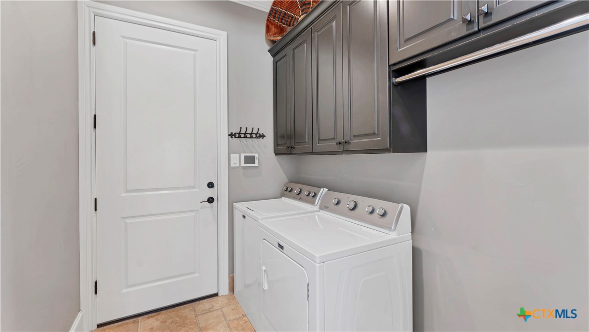 368 Rancho Road New Braunfels, TX 78130 - Photo 31 of 47 a utility room with dryer and washer