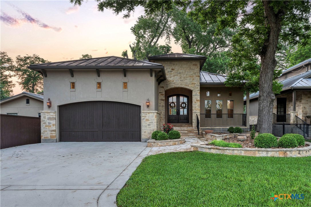 368 Rancho Road New Braunfels, TX 78130 - Photo 45 of 47 a front view of a house with garden