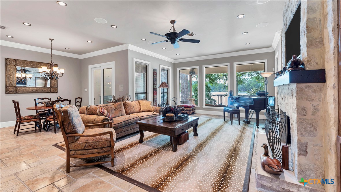 368 Rancho Road New Braunfels, TX 78130 - Photo 6 of 47 a living room with furniture and a flat screen tv