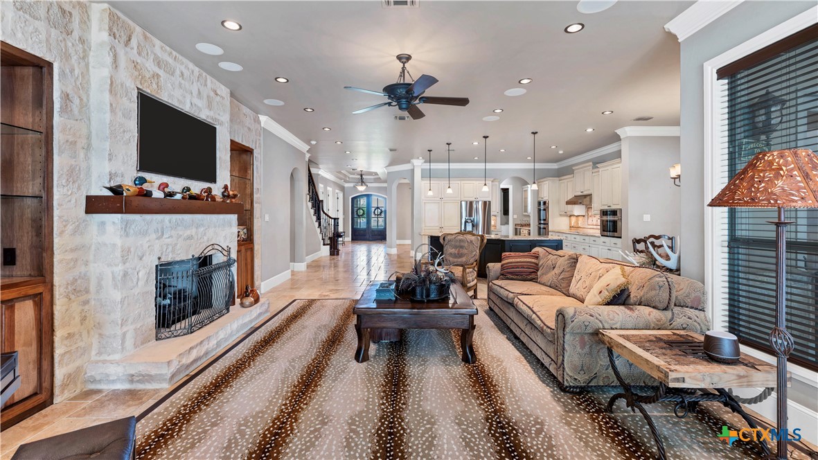 368 Rancho Road New Braunfels, TX 78130 - Photo 9 of 47 a living room with furniture fireplace and flat screen tv