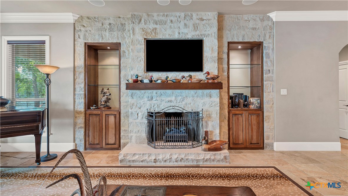 368 Rancho Road New Braunfels, TX 78130 - Photo 10 of 47 a living room with furniture and a fireplace