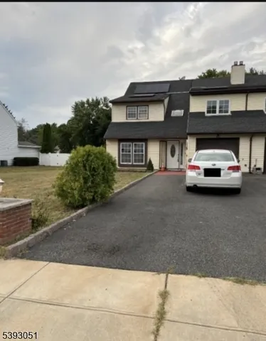 a car parked in front of a house