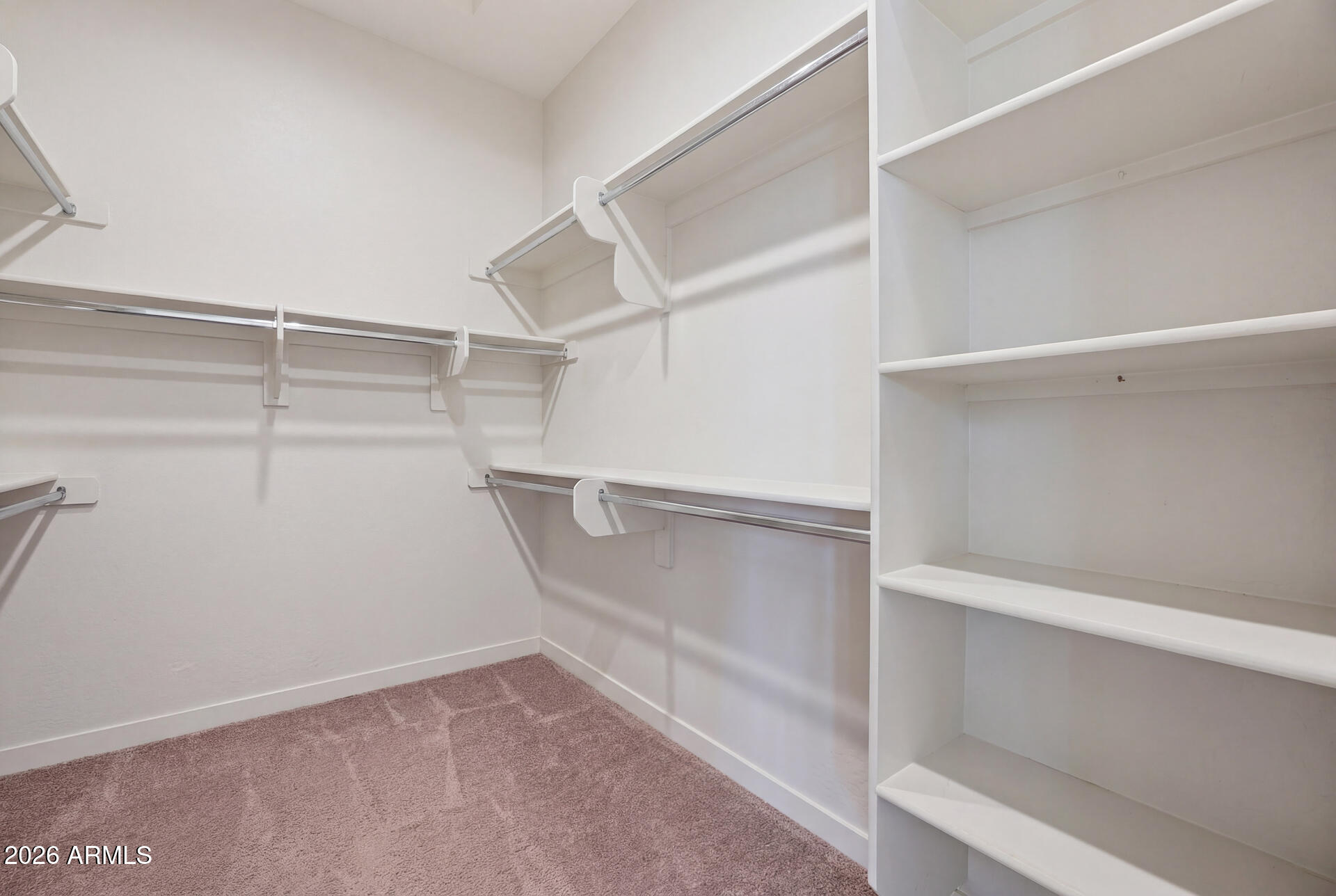 23069 East Mayberry Road Queen Creek, AZ 85142 - Photo 22 of 48 a view of an empty walk in closet
