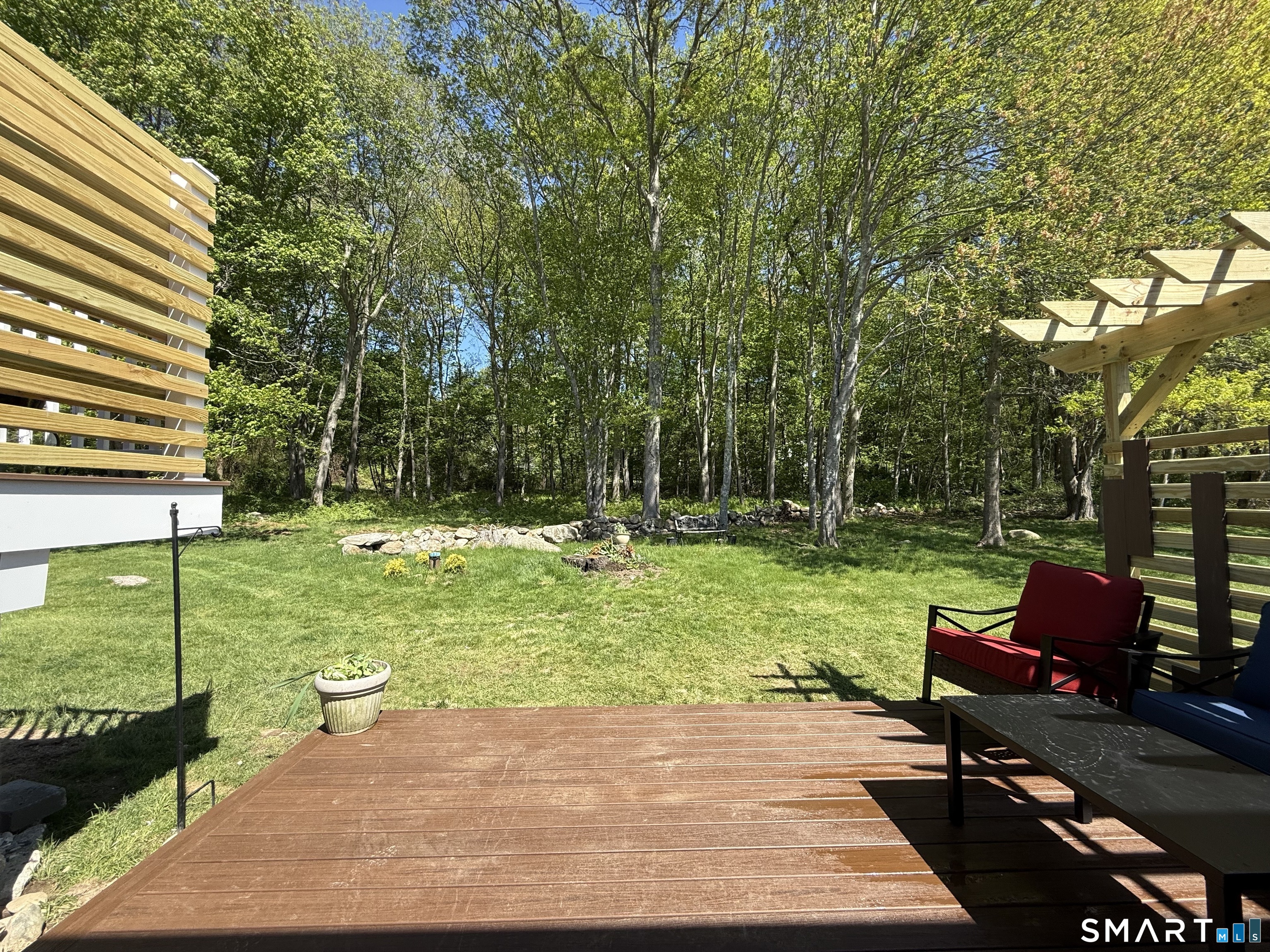 29 Deer Ridge Road Stonington, CT 06378 - Photo 35 of 35 a view of a yard with furniture