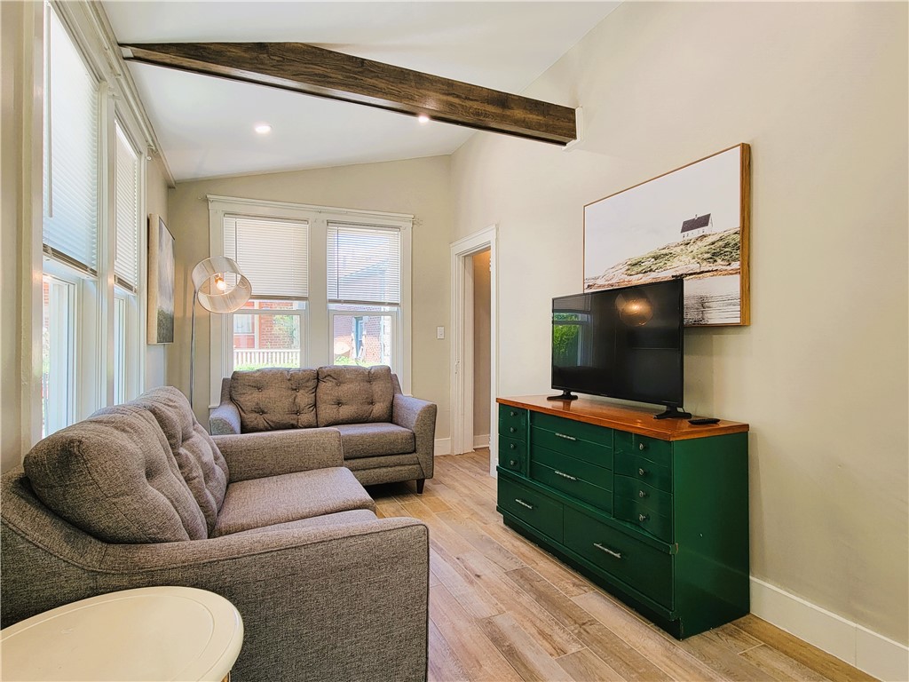 129 Connection Street Newport, RI 02840 - Photo 4 of 23 Living room with exposed beams and comfy couches