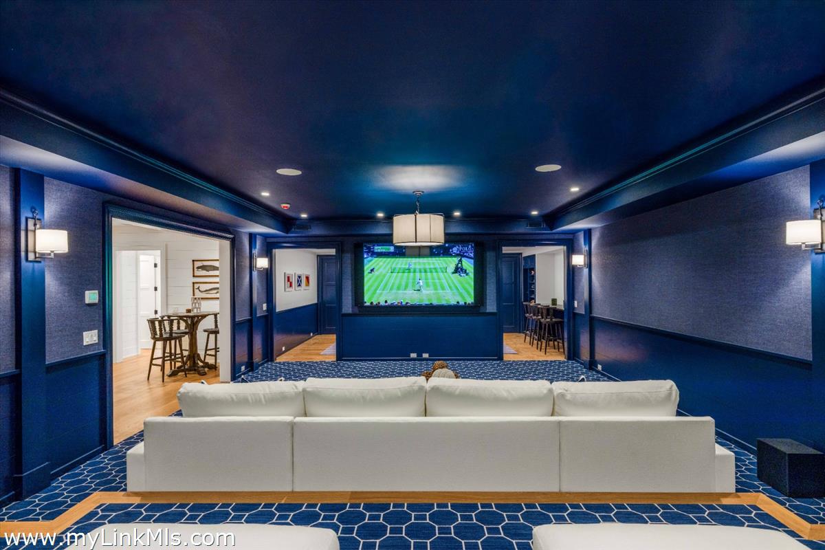 256 Polpis Road Nantucket, MA 02554 - Photo 24 of 30 a living room with furniture and a flat screen tv