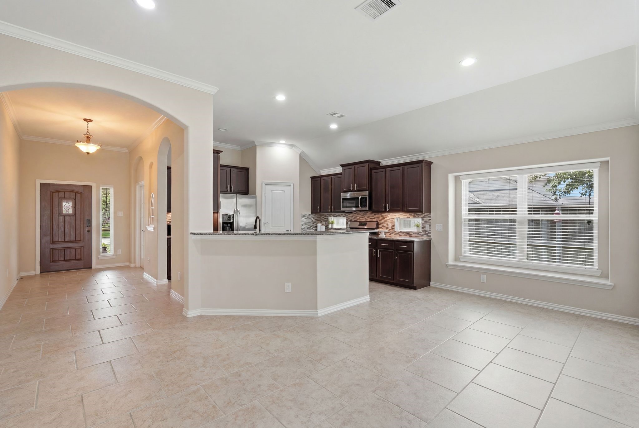 18227 Tacoma Ridge Drive Tomball, TX 77377 - Photo 12 of 45 Open-concept living and dining areas connected by a bright and inviting layout.