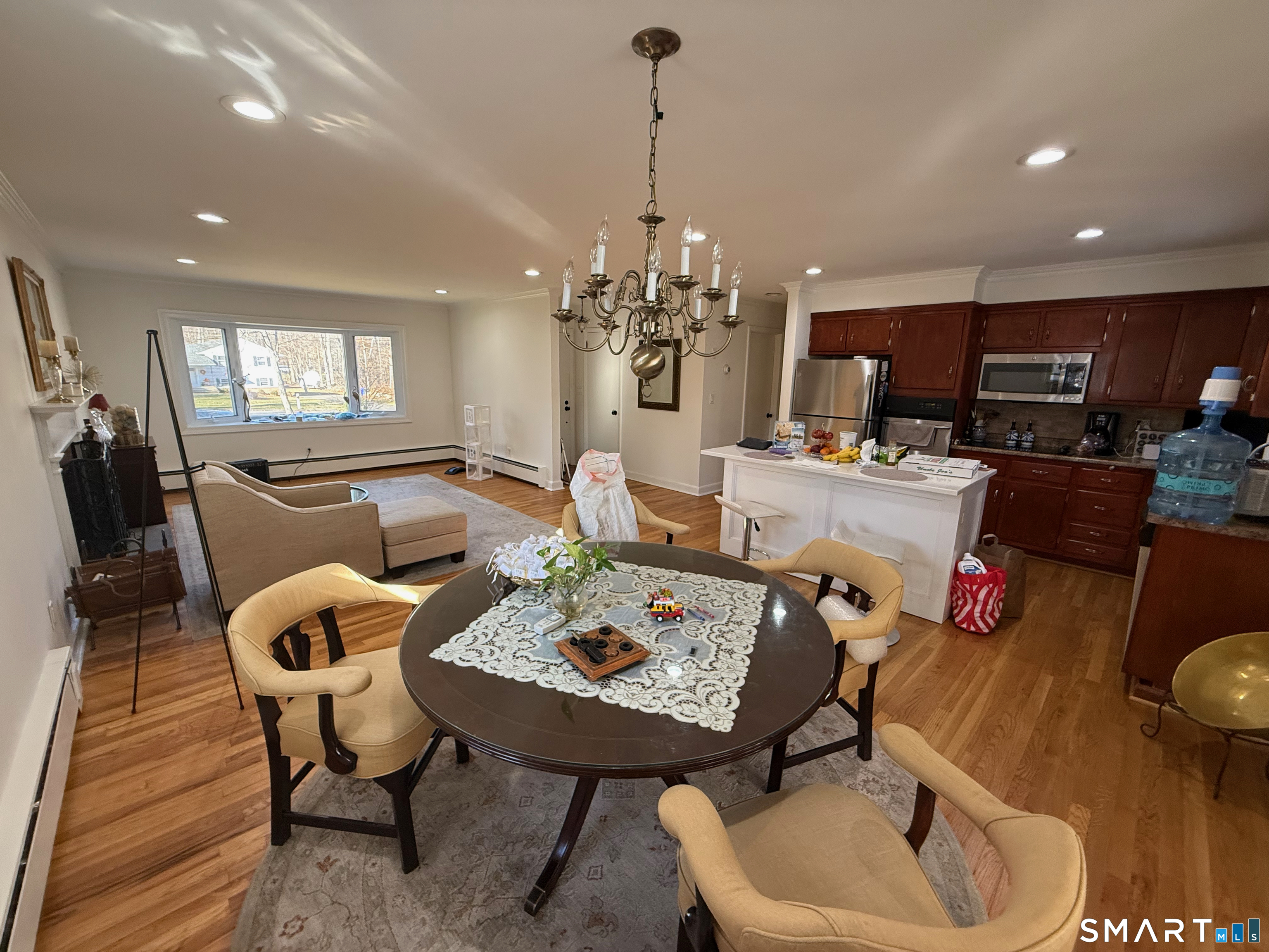10 Purdy Road Norwalk, CT 06850 - Photo 11 of 21 a living room with furniture and a chandelier