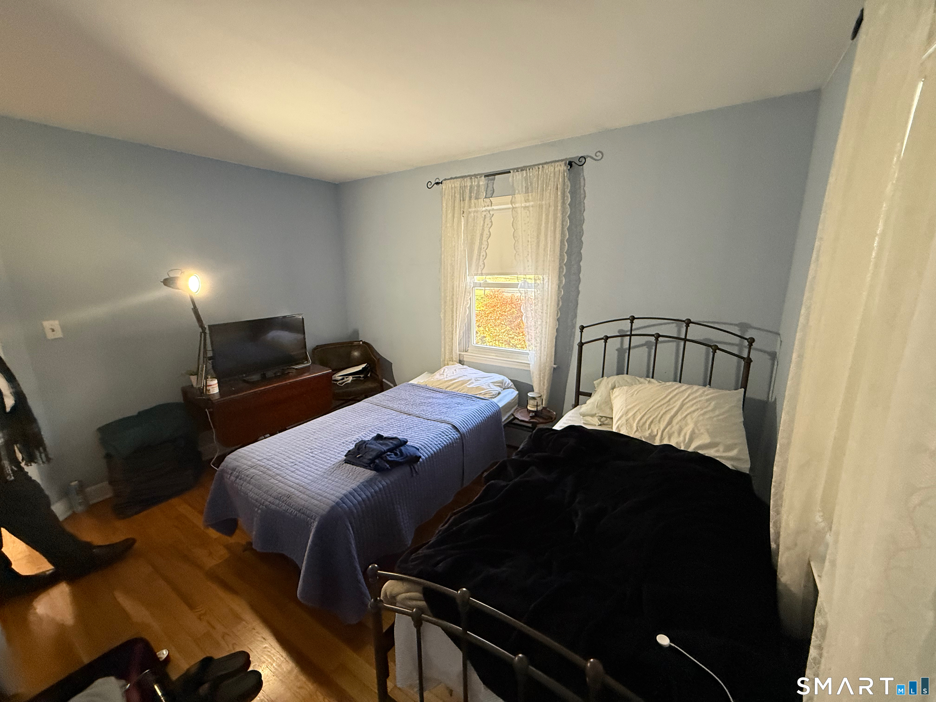 10 Purdy Road Norwalk, CT 06850 - Photo 14 of 21 a bedroom with a bed and a potted plant