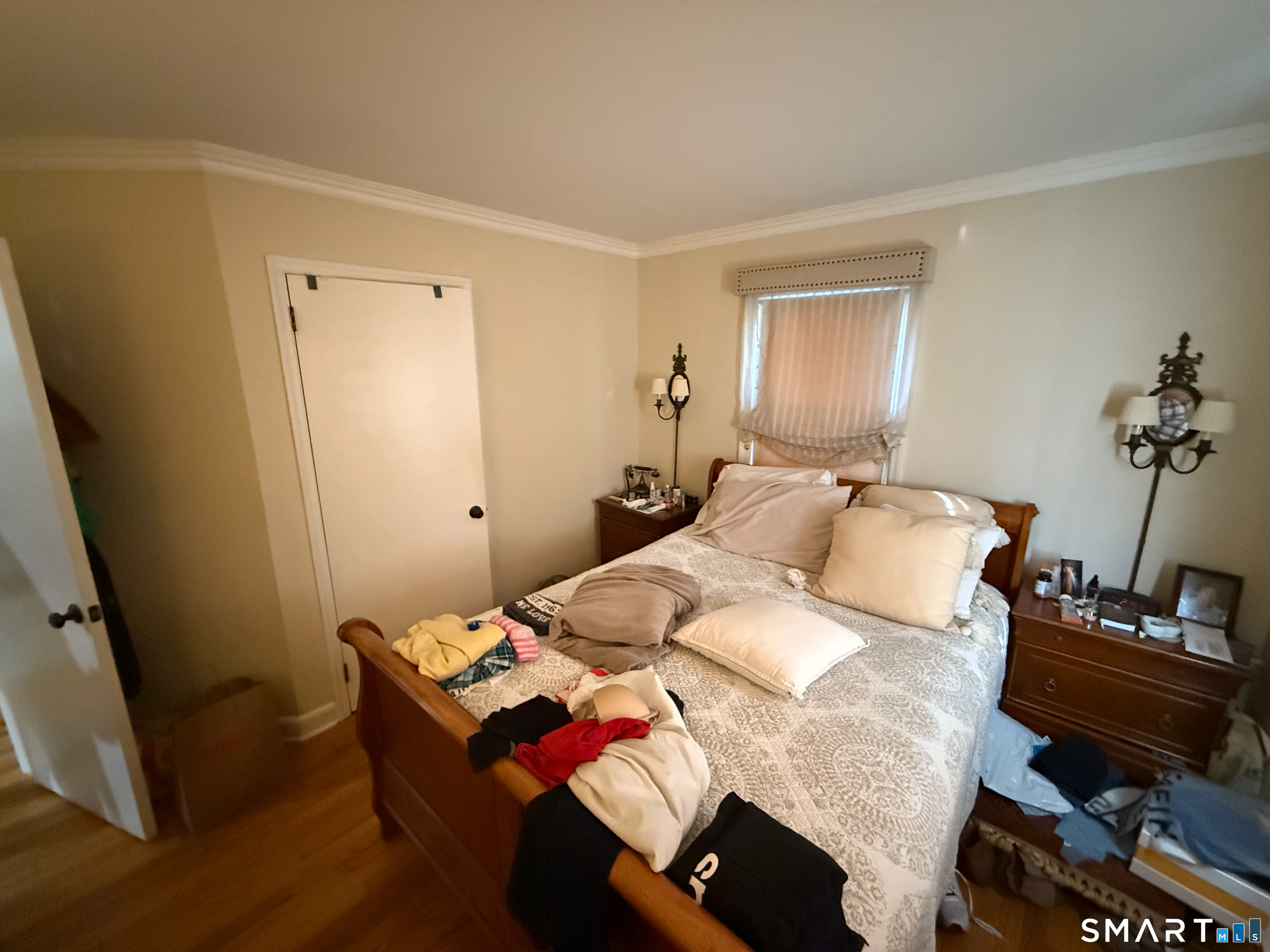 10 Purdy Road Norwalk, CT 06850 - Photo 15 of 21 a bedroom with a bed and wooden floor